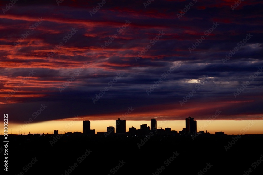 Fototapeta premium Sunset over the skyline of Fort Worth with a dramatic sky