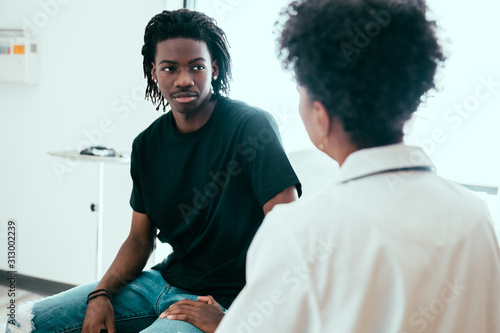 Male patient listening to doctor