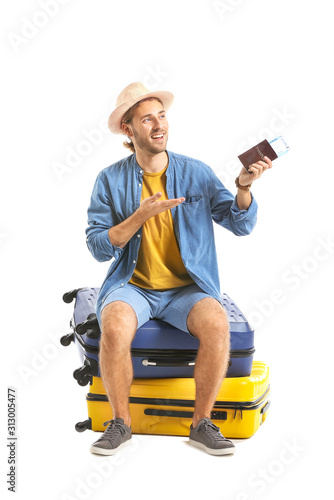 Young tourist with luggage ...