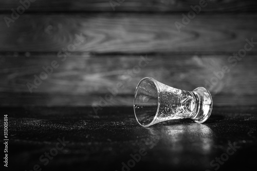 Empty glass on table. Concept of alcoholism photo