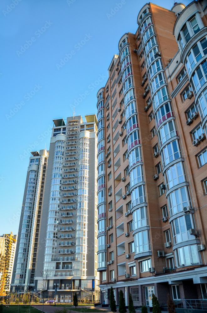 The new multi-storey residential building on blue sky background, Kyiv, Ukraine