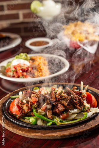 Canvas Print sizzling beef fajita platter