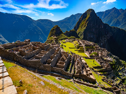 Archaeological complex of Machu Picchu with Huayna Picchu and Andes mountain range as background. Cusco Region, Peru