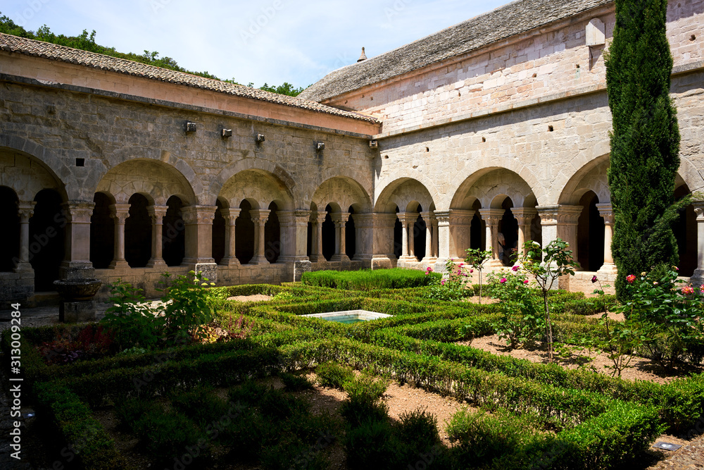 Garden and patio of the old monastery Notre-Dame de Sénanque in the Provence in France