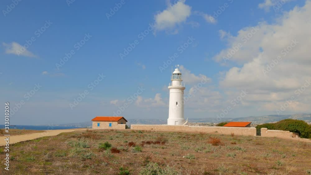 Holidays on the coast of Cyprus. Lighthouse and caretaker's house next to the archaeological park near the city of Paphos. Holidays on the coast of Cyprus. Lighthouse and caretaker's house next to the archaeological park near the city of Paphos.