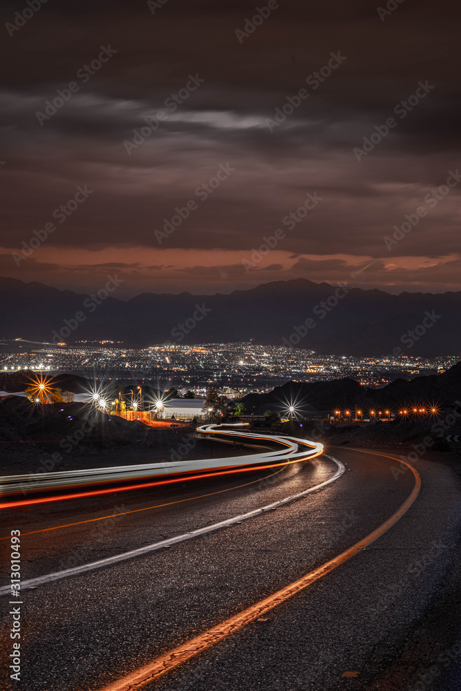 highway long exposure vehicle light trails curvy highway between mountains eilat israel	