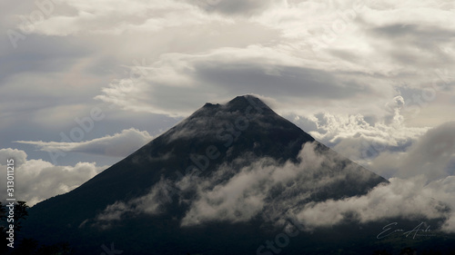 Arenal Volcano With Clouds Blue Sky Sunset