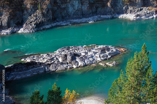 Turquoise Katun River in the rocky mountains of Altai on a sunny day. Altai Territory in Siberia