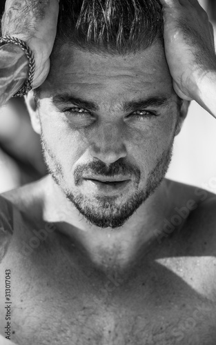 Handsome and fit Caucasian male on the beach