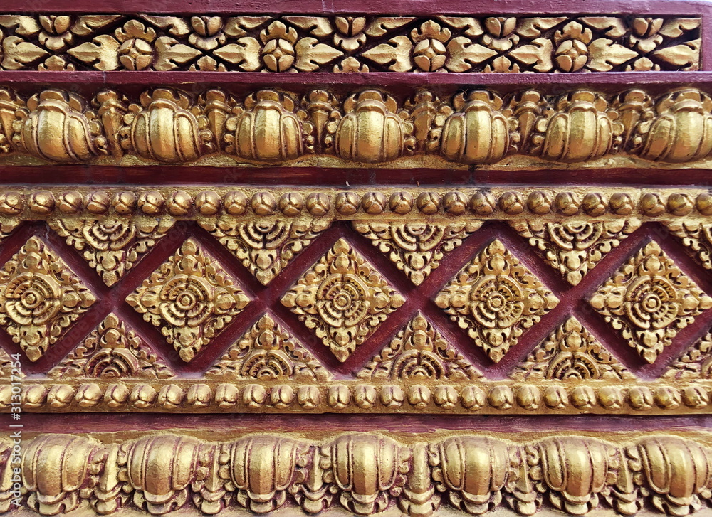 Traditional Thai style stucco on the wall of church in temple, Thailand.