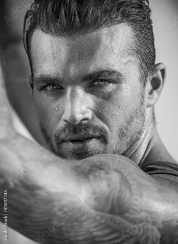 Handsome and fit Caucasian male on the beach