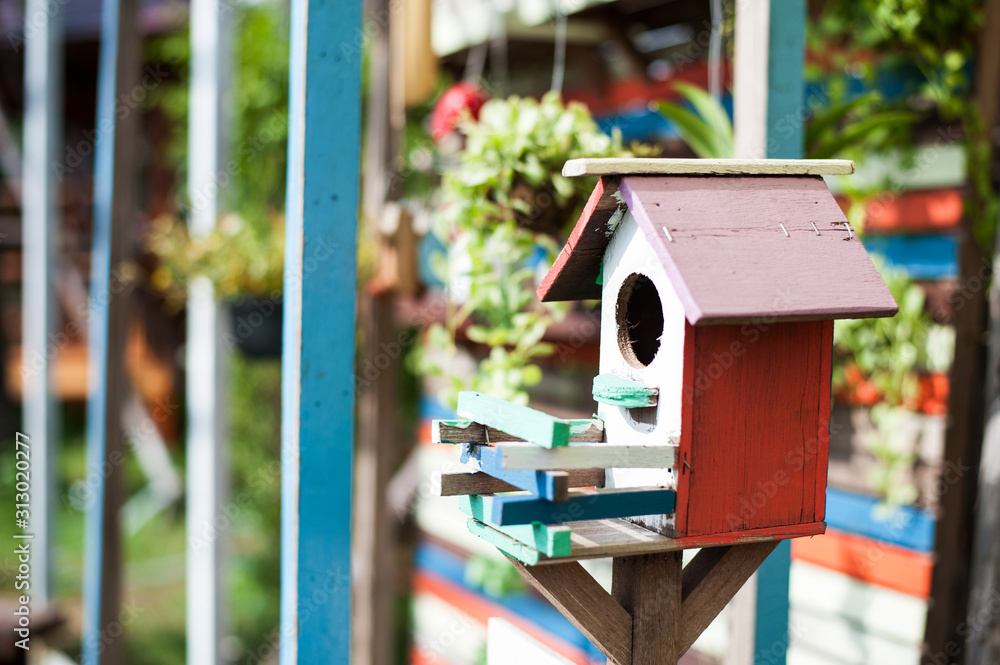 Beautiful wooden bird houses on the lawn Beautiful wooden bird houses on the lawn