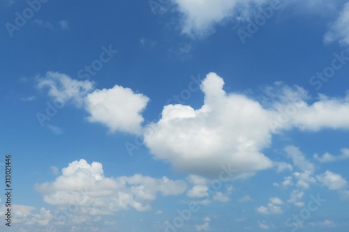 Beautiful fluffy clouds in blue sky  natural background