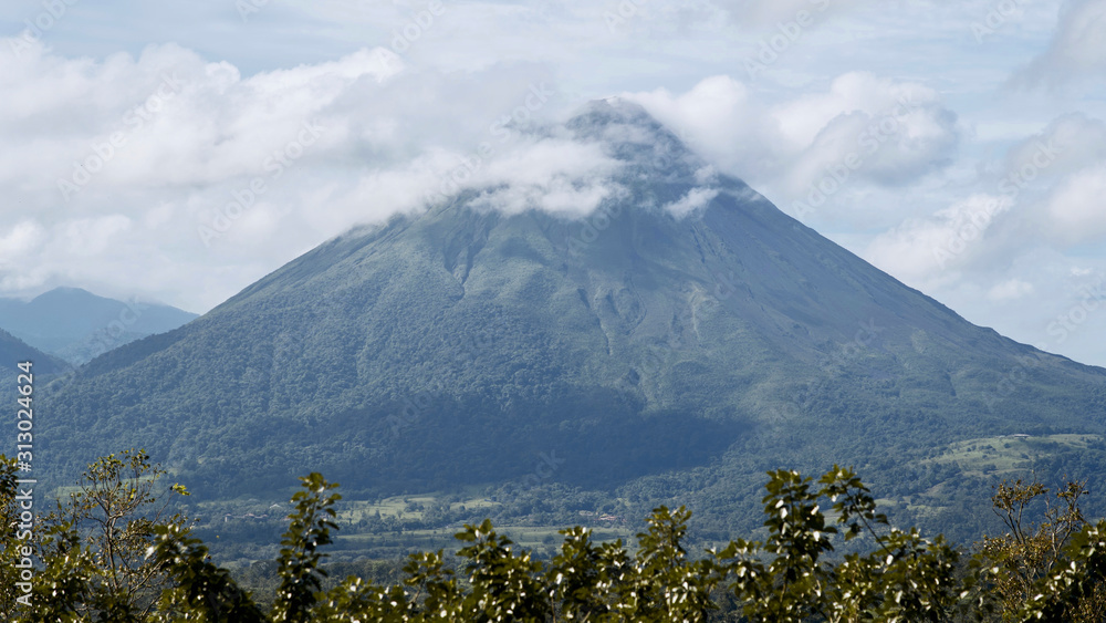 Fototapeta premium Arenal Volcano Blue Sky White Clouds