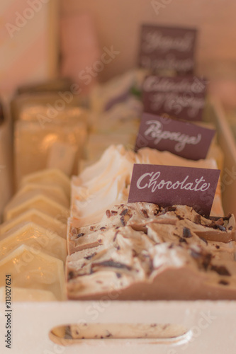 Chocolate blanco de diversos sabores en chocolatería o expendio de dulcces photo