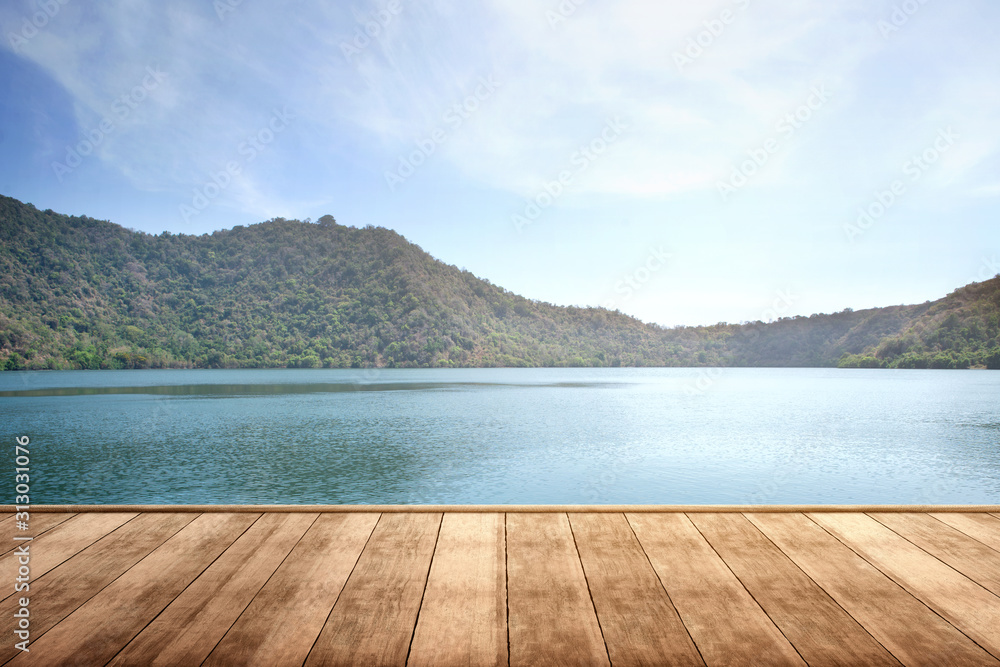 Wooden terrace with lake and mountain view Wooden terrace with lake and mountain view