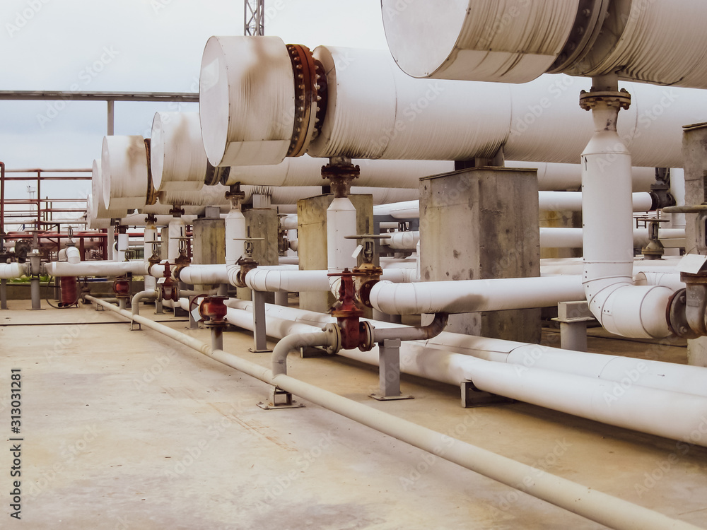 Heat exchangers in a refinery. The equipment for oil refining Heat exchangers in a refinery. The equipment for oil refining
