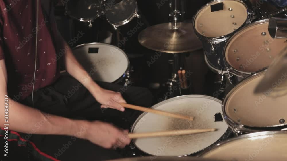 Tight shot of a drummer playing on the snare drum. Tight shot of a drummer playing on the snare drum.