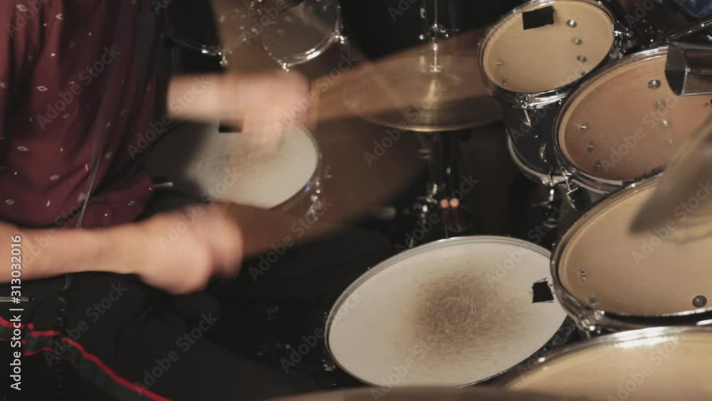 A drummer plays the build-up part of a song leading into a crescendo. A drummer plays the build-up part of a song leading into a crescendo.