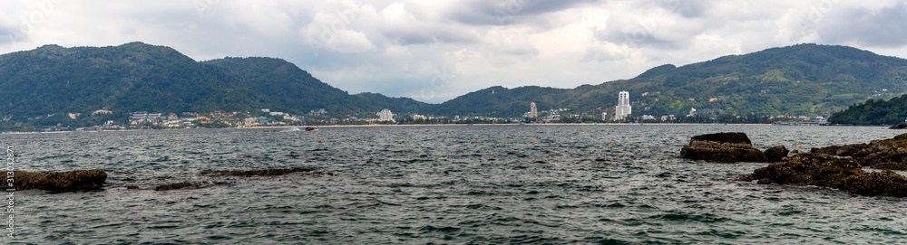 Phuket skyline and cityscape seen from Andaman Sea. Selective focus.