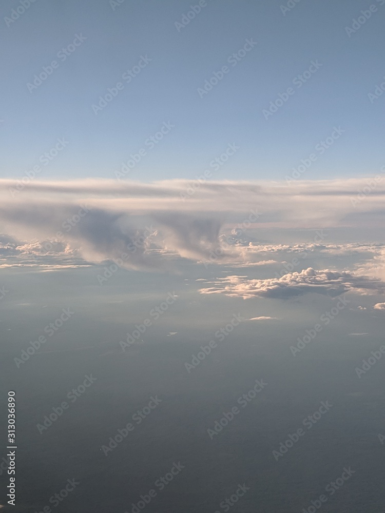 the sky from the window of the plane window