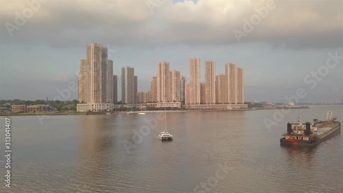 White Boat With Beautiful Apartment View - Aerial View - Static  photo