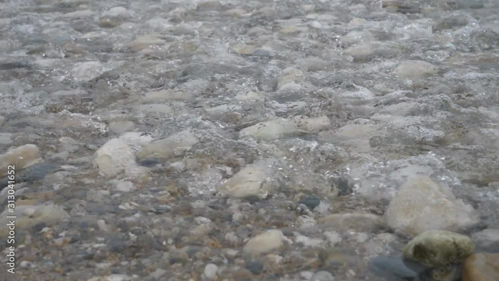 A shallow mountain river flow. A shallow mountain river flow.
