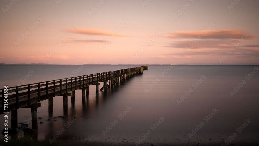 Long exposure image of Cornwallis Wharf in Auckland at sunset