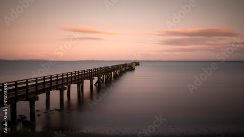 Long exposure image of Cornwallis Wharf in Auckland at sunset © Janice
