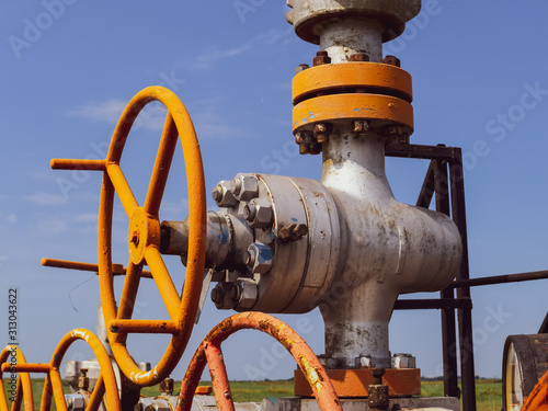 Oil well wellhead equipment. Hand valve with handwheel for opening and closing the flow line.