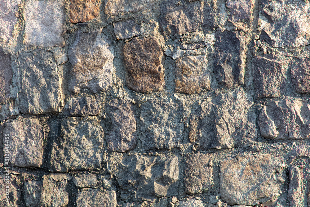 Fototapeta premium Wall of stone blocks as an abstract background