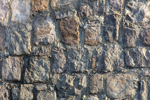 Wall of stone blocks as an abstract background