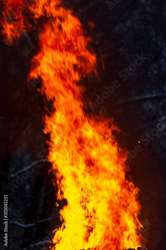 Flame of fire from a burning house as an abstract background