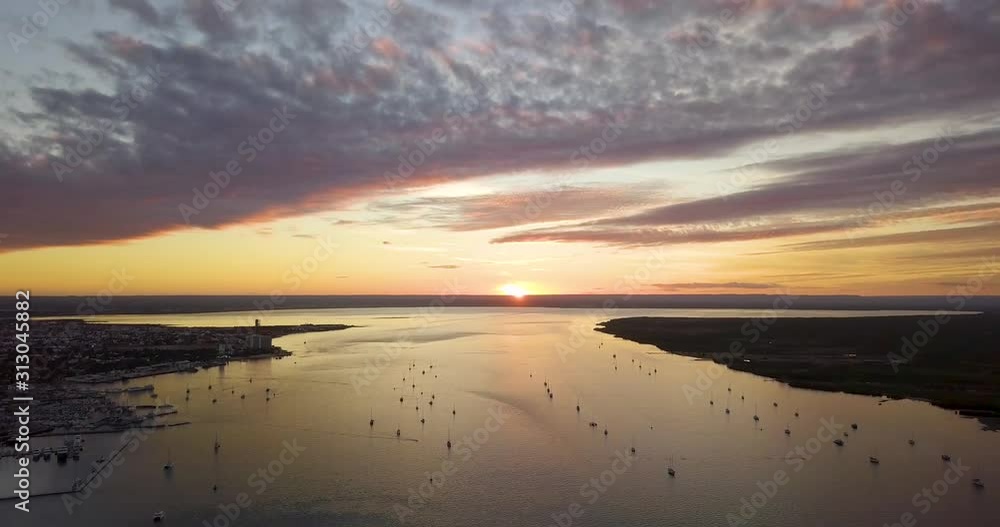 Aerial shot from a cloudy sunset in La Paz's pier with align boats. Baja California Sur, Mexico. Aerial shot from a cloudy sunset in La Paz's pier with align boats. Baja California Sur, Mexico.