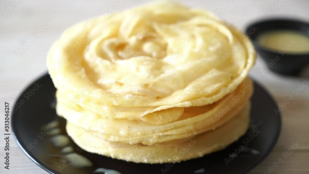 fried crispy roti dough with sweetened condensed milk fried crispy roti dough with sweetened condensed milk