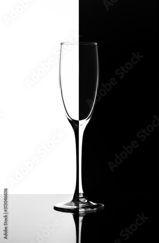 a glass of champagne or wine in the style of Domino