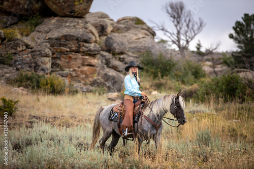 Cowgirl On Rocky Mountain Horse