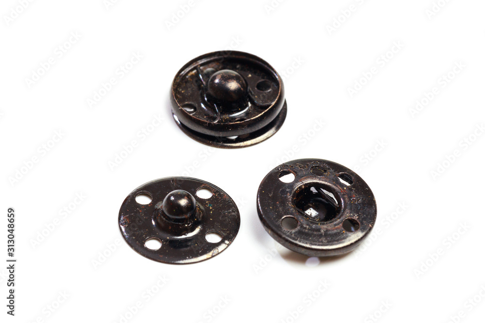 Close up of a group of metal Snap on Buttons on white background - Image Close up of a group of metal Snap on Buttons on white background - Image