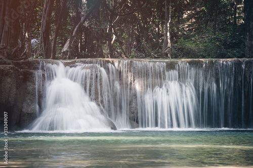 Fototapeta Naklejka Na Ścianę i Meble -  Close up of Huay Mae Khamin Second Level, Paradise Waterfall located in deep forest of Kanchanaburi Thailand.