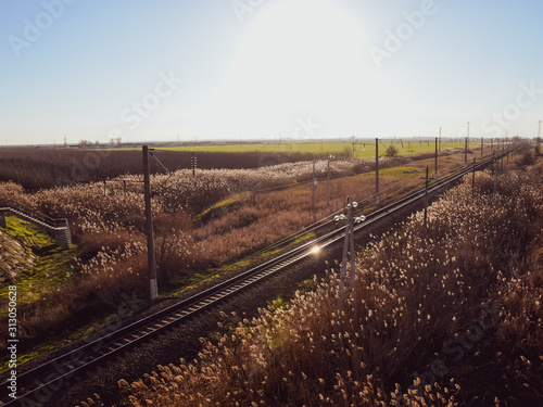 Plot railway. Top view on the rails. High-voltage power lines for electric trains photo