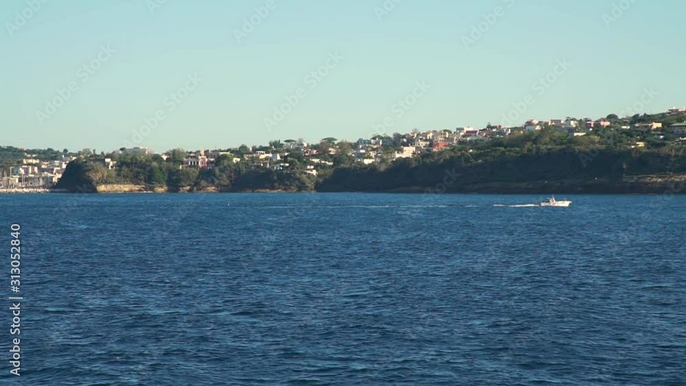 Landscape View of Naples Coast, Italy. View from a Ferry. Concept of Holidays, Vacations and Travel in Europe Landscape View of Naples Coast, Italy. View from a Ferry. Concept of Holidays, Vacations and Travel in Europe