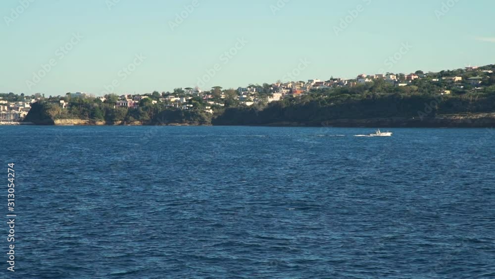 Landscape View of Naples Coast, Italy. View from a Ferry. Slow Motion. Concept of Holidays, Vacations and Travel in Europe Landscape View of Naples Coast, Italy. View from a Ferry. Slow Motion. Concept of Holidays, Vacations and Travel in Europe