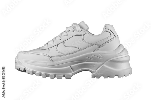 White women's leather sneaker with a massive sole.