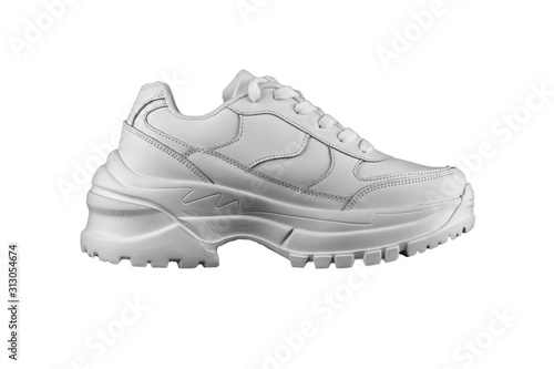 White women's leather sneaker with a massive sole.