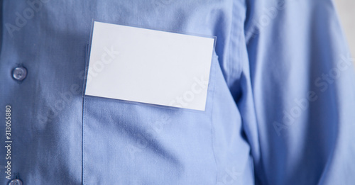 Business card in shirt pocket. Business