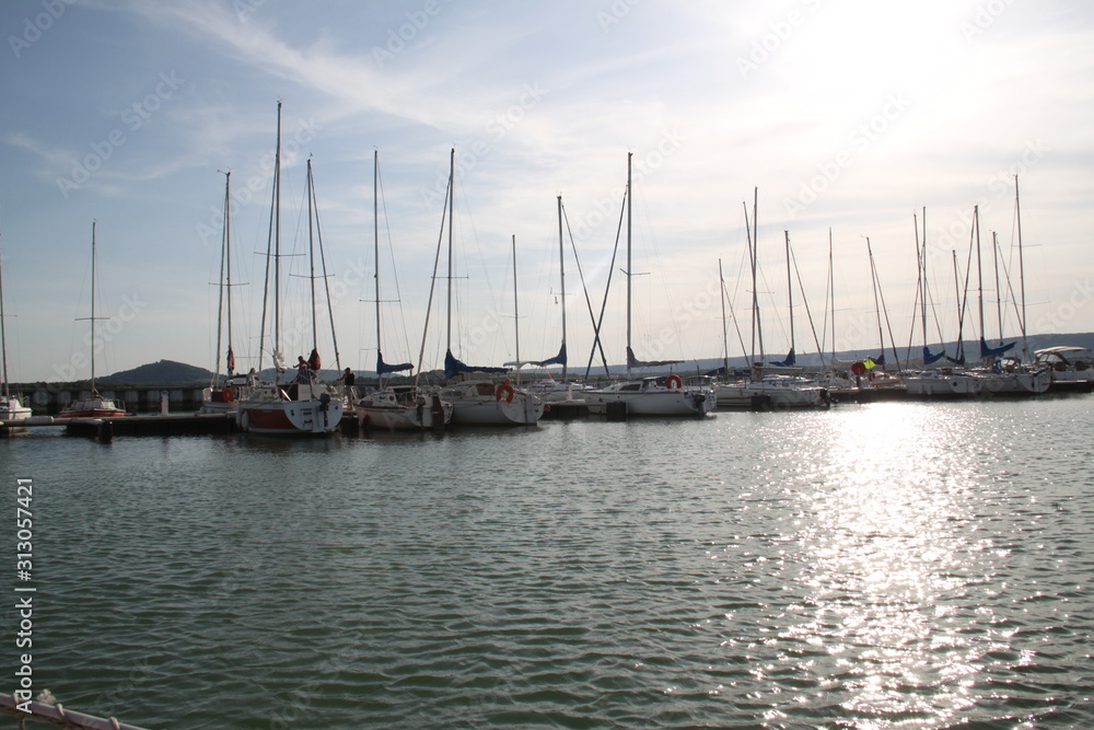 Fototapeta premium Madine lake sails port in the sunset