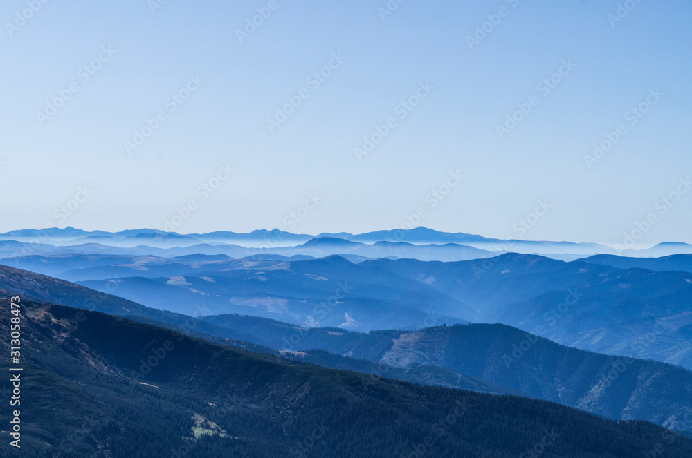 Mountain clean landscape for the background of the website landing page or booklet. Rocks and hills far in the horizon. Colored sky.