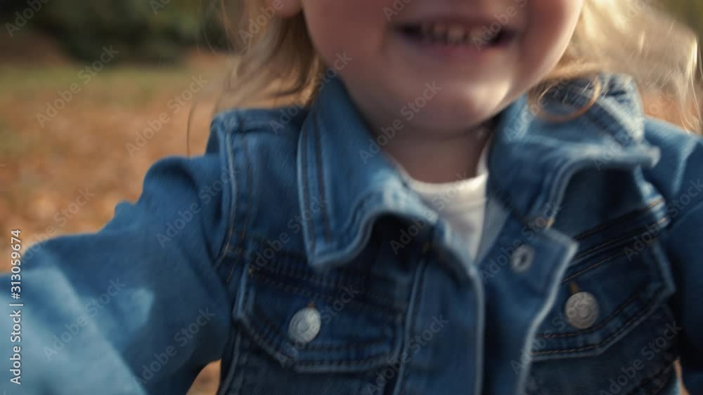 Extreme Close Up of Happy Little Blond Girl in Fall Season Extreme Close Up of Happy Little Blond Girl in Fall Season