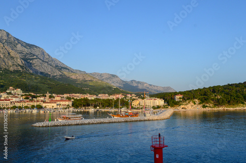 Fototapeta Naklejka Na Ścianę i Meble -  View of Makarska city center from the sea in Makarska,  Dalmatia, Croatia on June 11, 2019. 