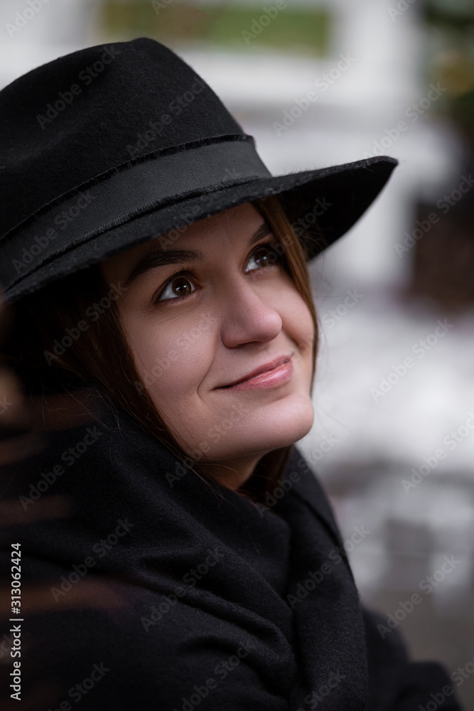 A girl in a hat walks in the rain. Mery Poppins goodbye! A girl in a hat walks in the rain. Mery Poppins goodbye!